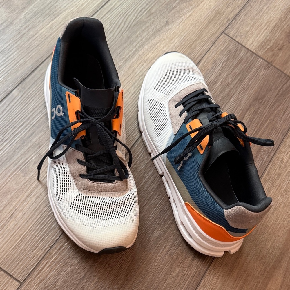 Stylish White and Navy Sneakers with Orange Highlights